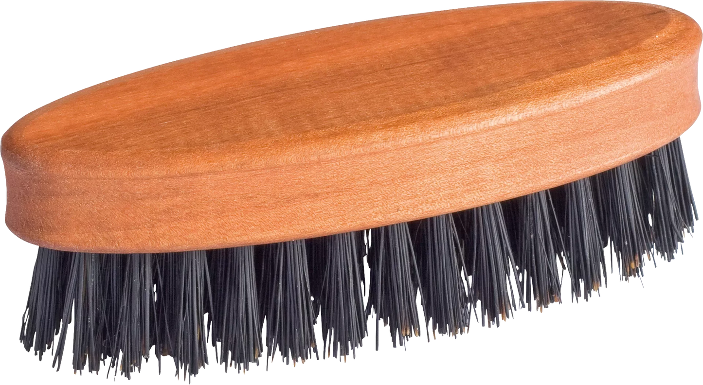 Wooden brush with black bristles on a white background