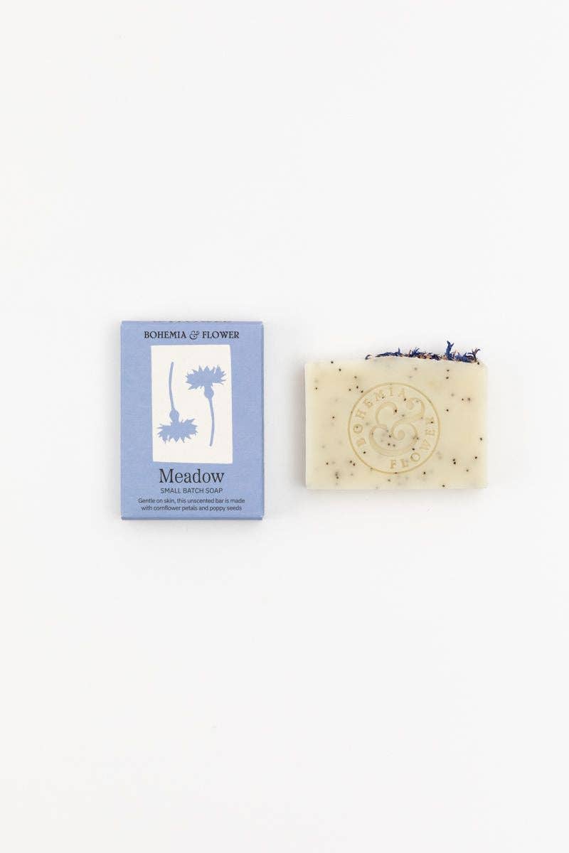 Bar of soap with packaging labeled 'Meadow' on a white background