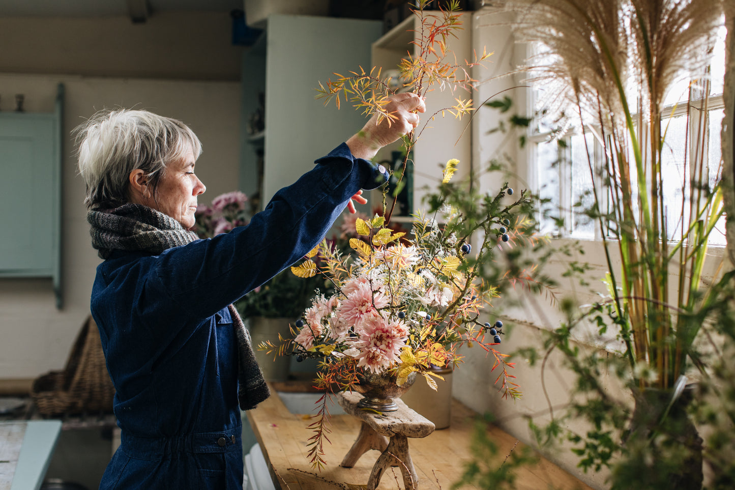 Rachel Siegfried arranging flowers in a workshop setting