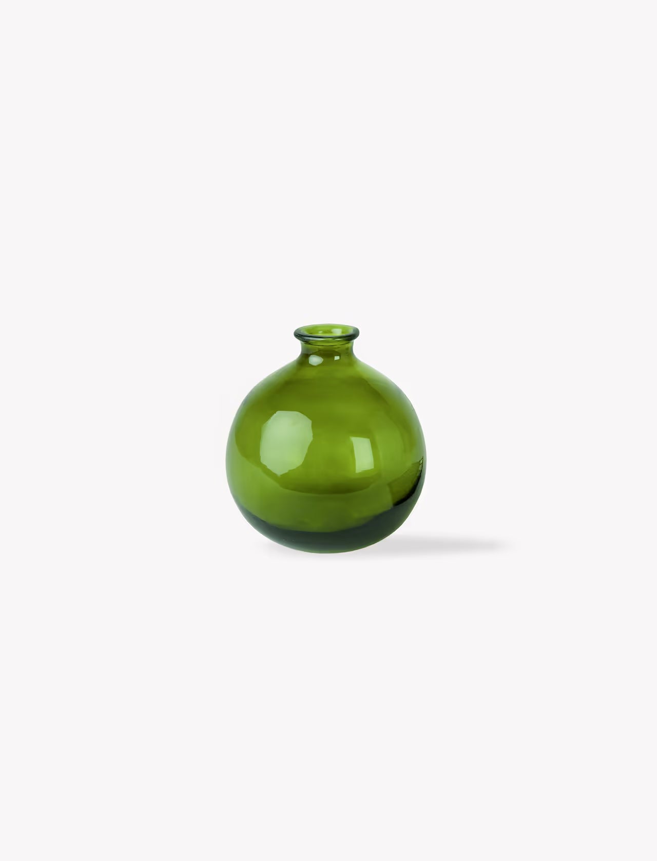 Green glass vase on a white background