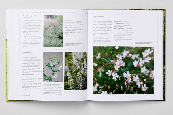 Open book with text and images of plants on a white background