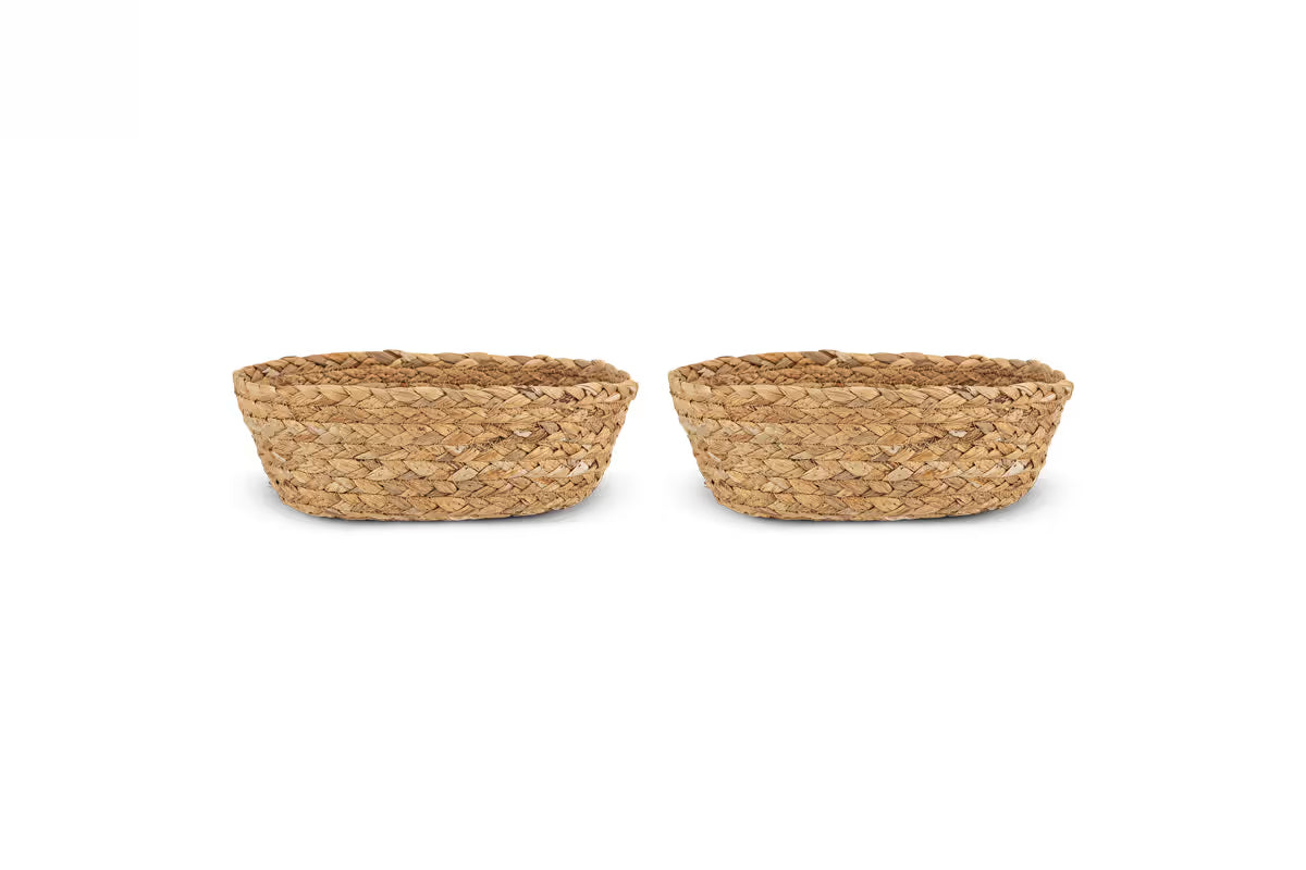 Two woven baskets on a white background