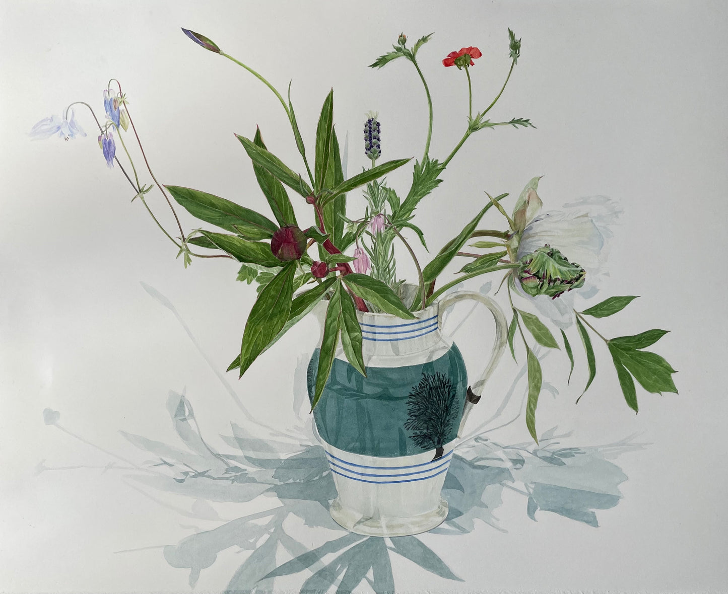 Vase with green and white stripes containing a bouquet of wildflowers on a light gray background