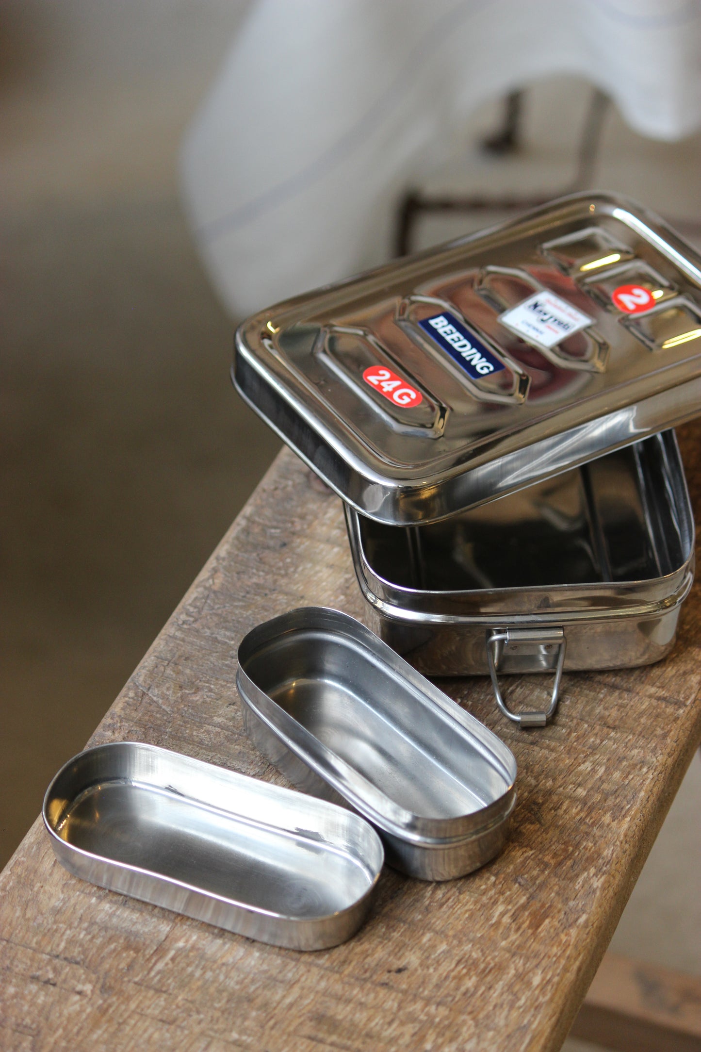 Metallic lunchbox on a wooden surface