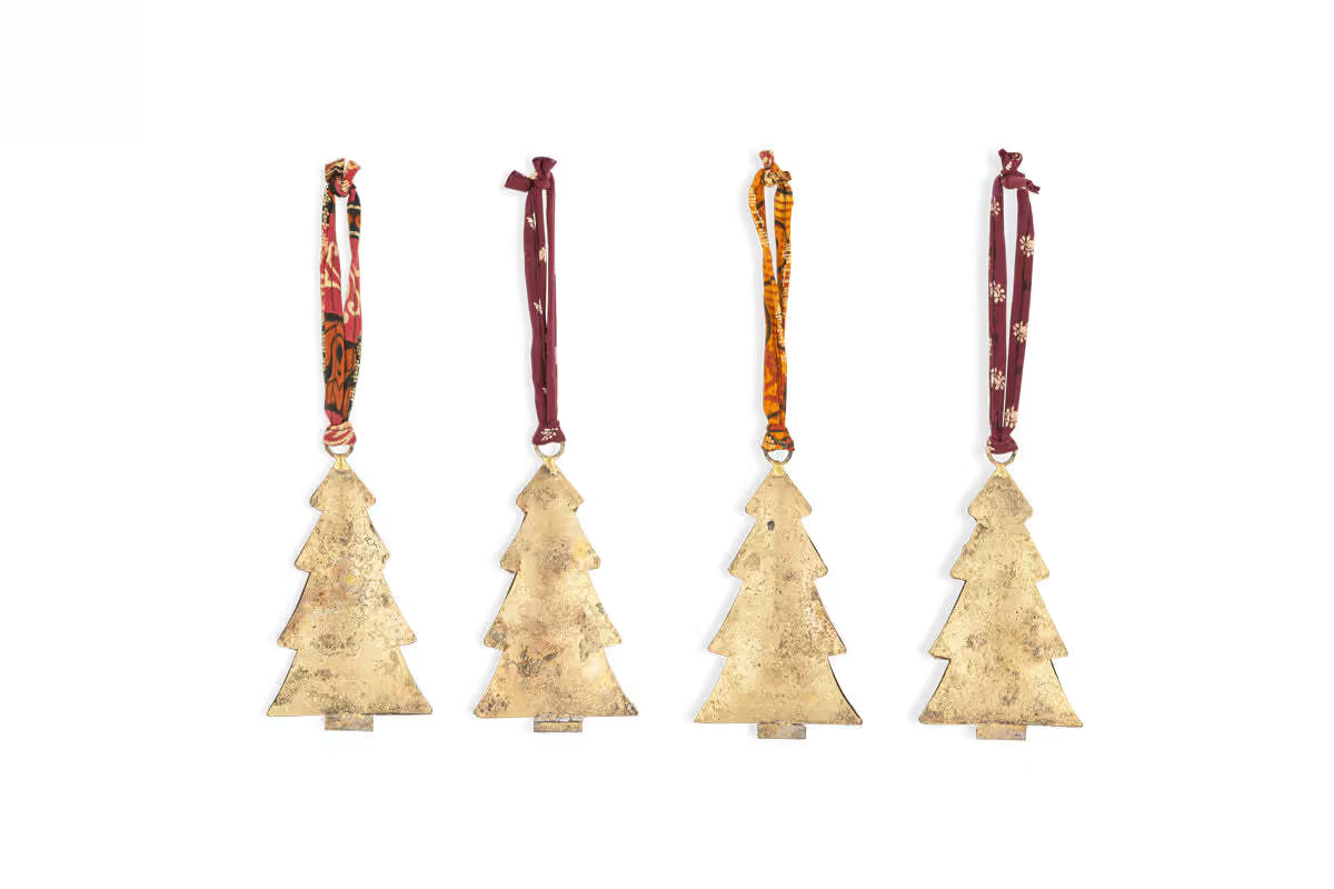 Four gold Christmas tree-shaped ornaments with colourful ribbons on a white background. Four gold Christmas tree ornaments nkuku Mishti Tree Baubles