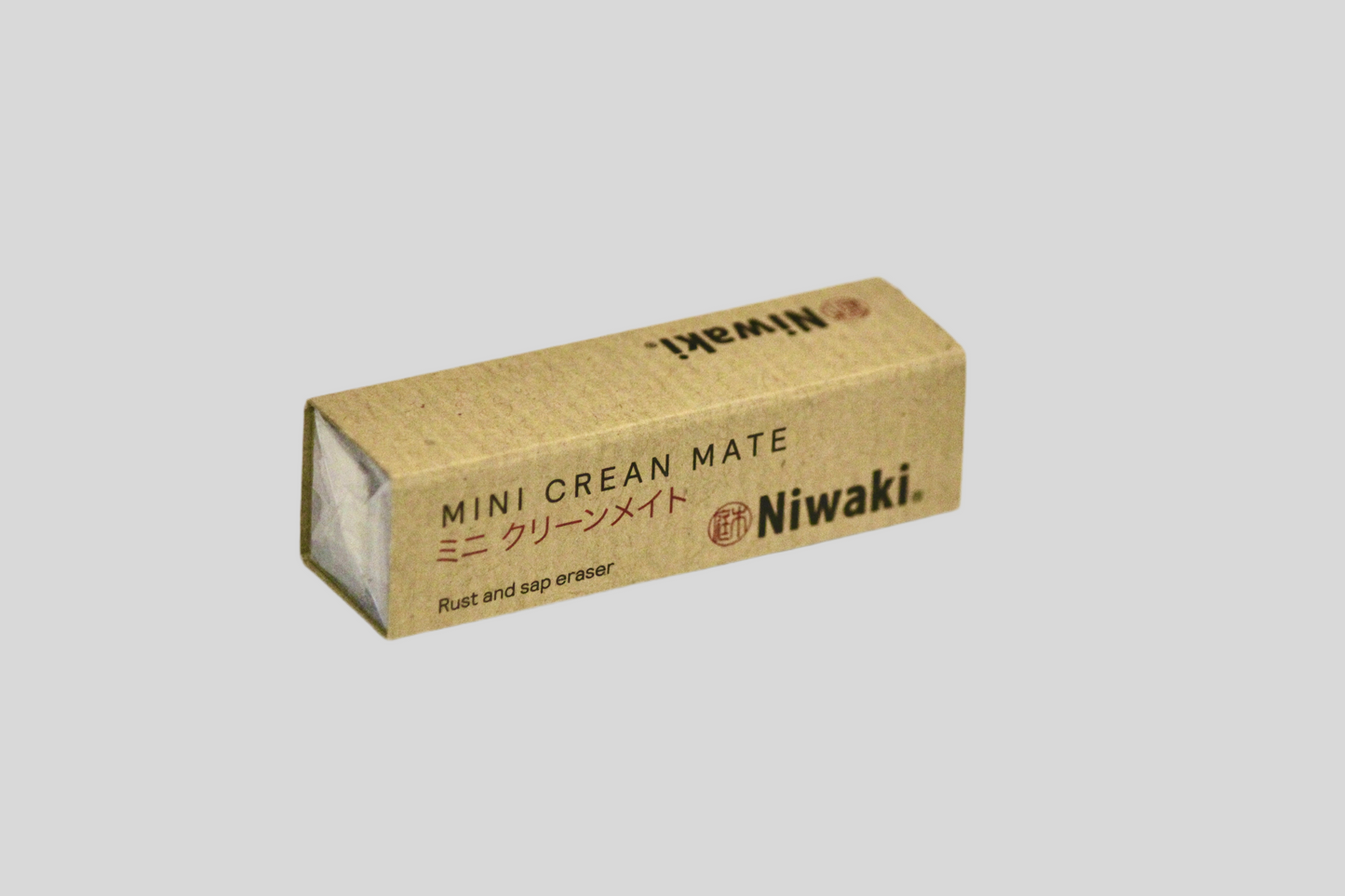 A mini crean mate garden tool cleaner packaged in a small, brown cardboard box with Japanese text and the Niwaki brand logo.