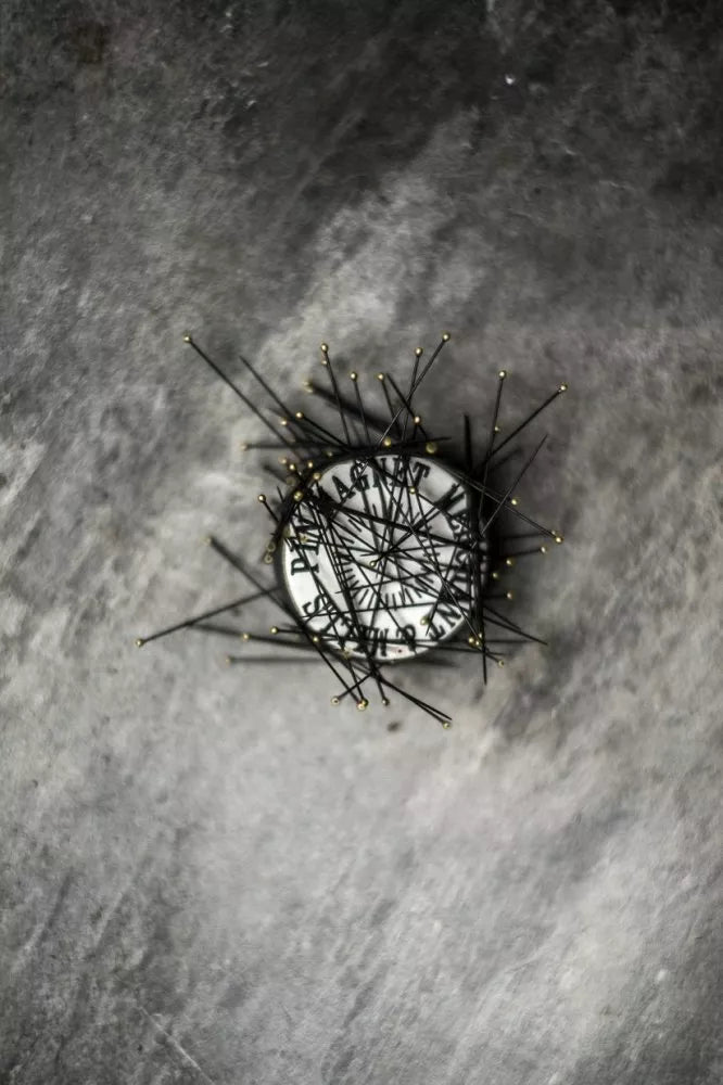 Pin Magnet on a textured gray background
