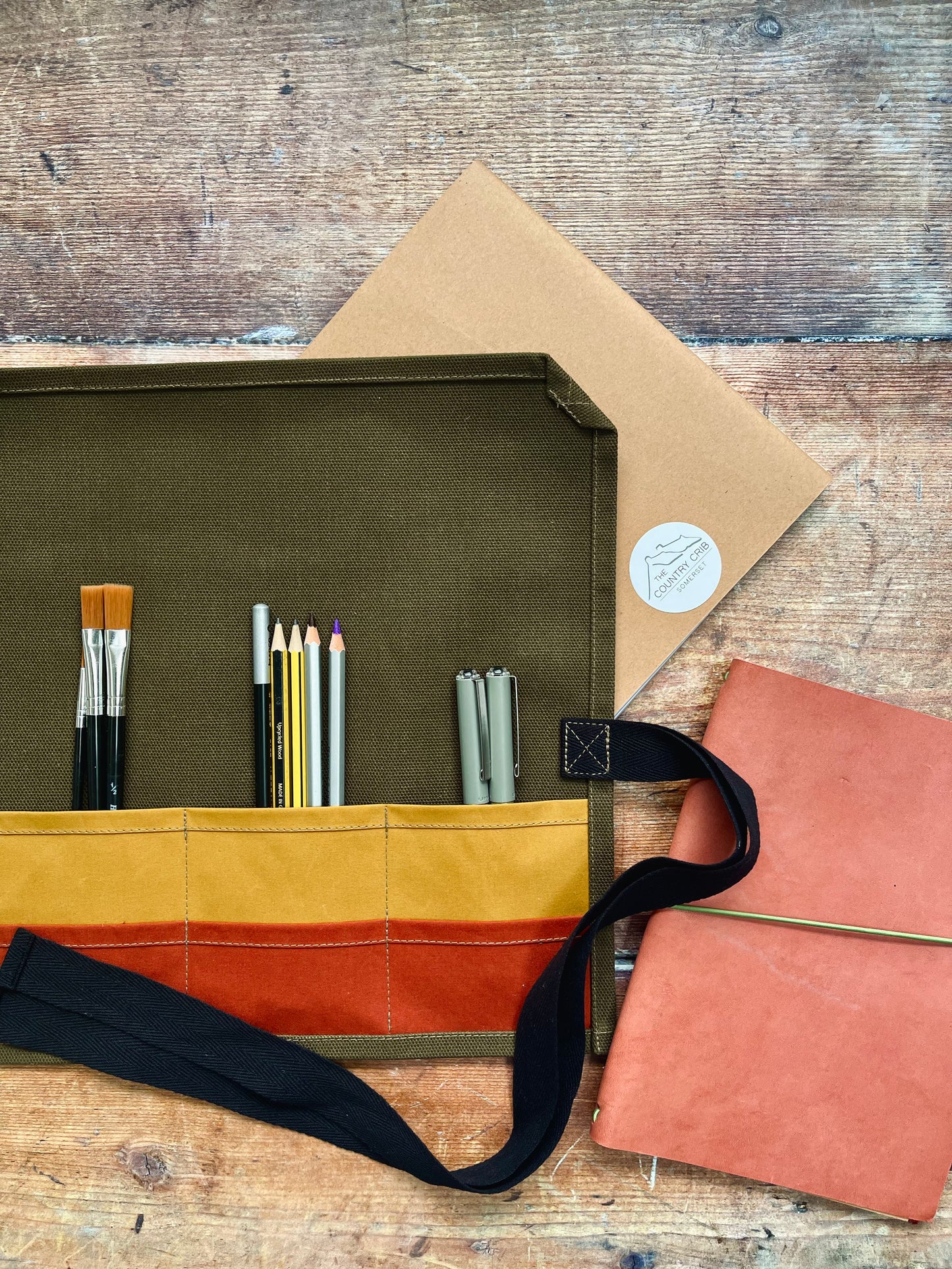 An extremely useful and versatile artist roll, made with organic dry waxed cotton canvas. Designed and handcrafted by us at The Country Crib. Keep all your pens, brushes and equipment together in this essential addition to your art and crafts kit.