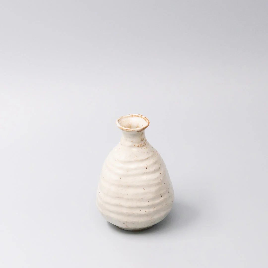 Sake Jug White Sand Glaze White ceramic vase on a light gray background