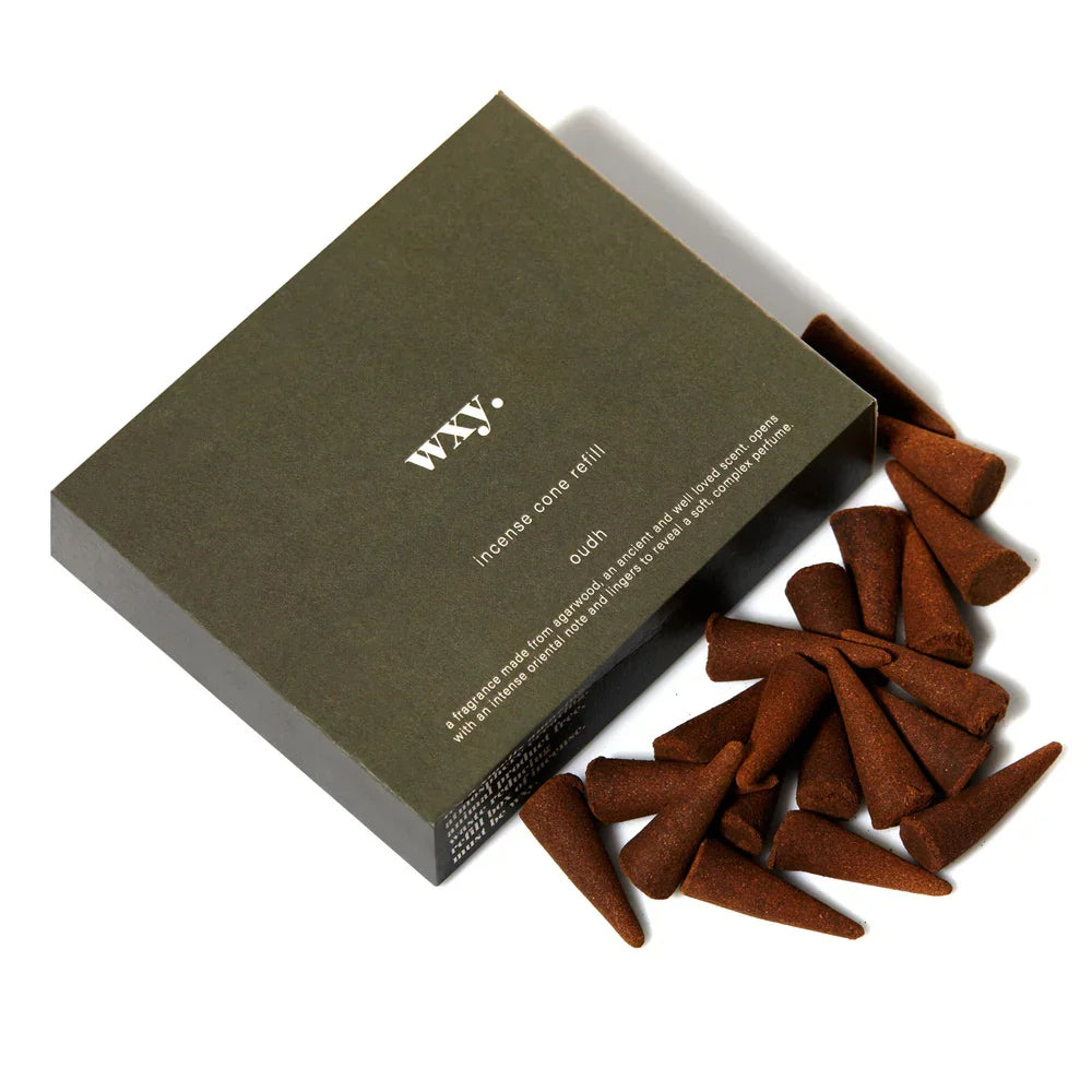 Incense cones with a WXY branded box on a white background