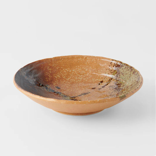 Ceramic bowl with a textured surface on a white background