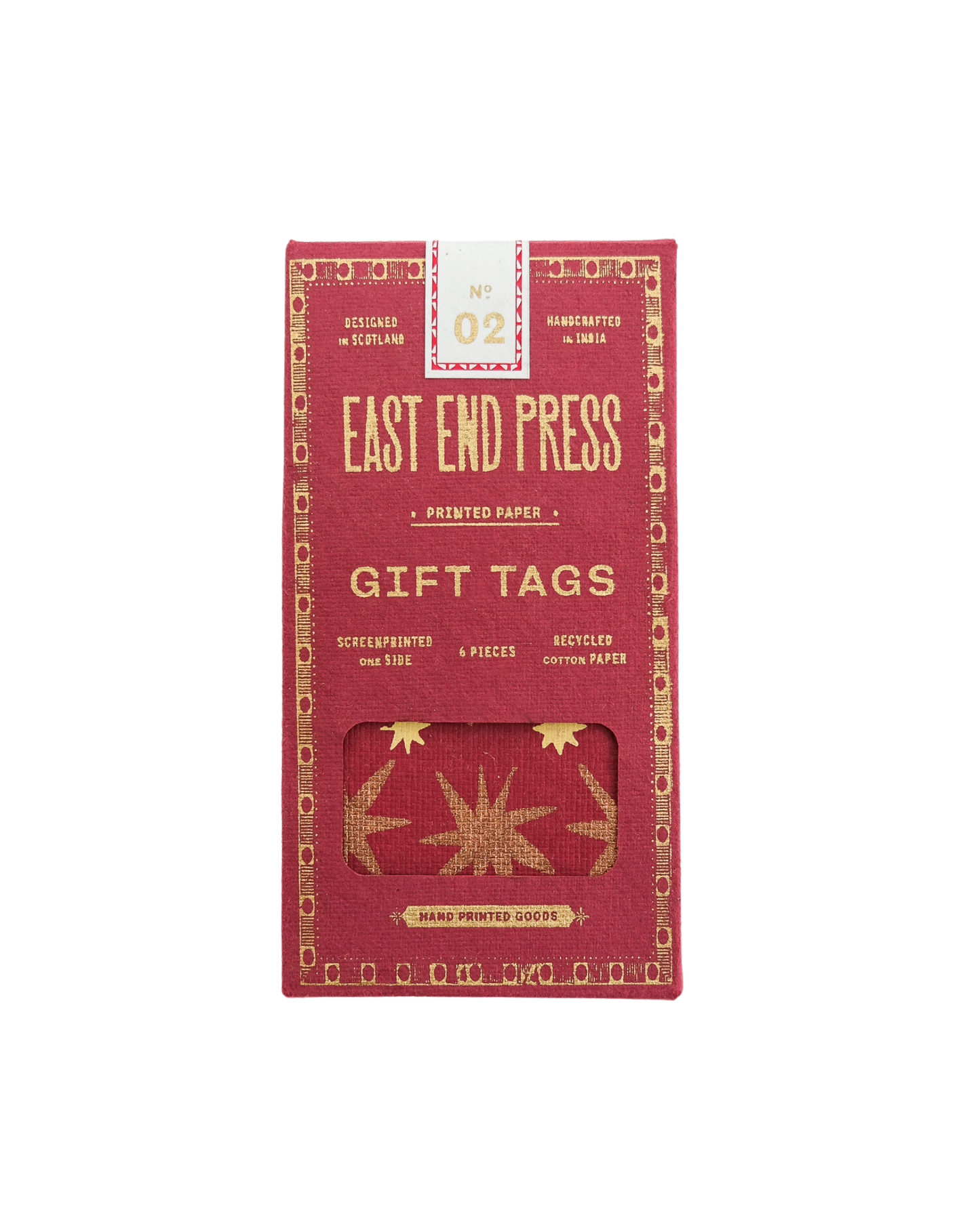 Red box of East End Press gift tags with gold text and design on a white background