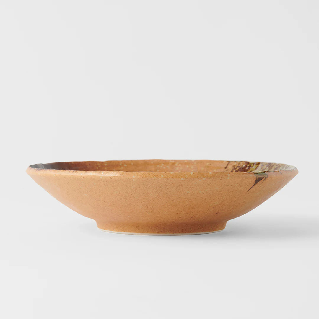 Brown ceramic bowl on a white background
