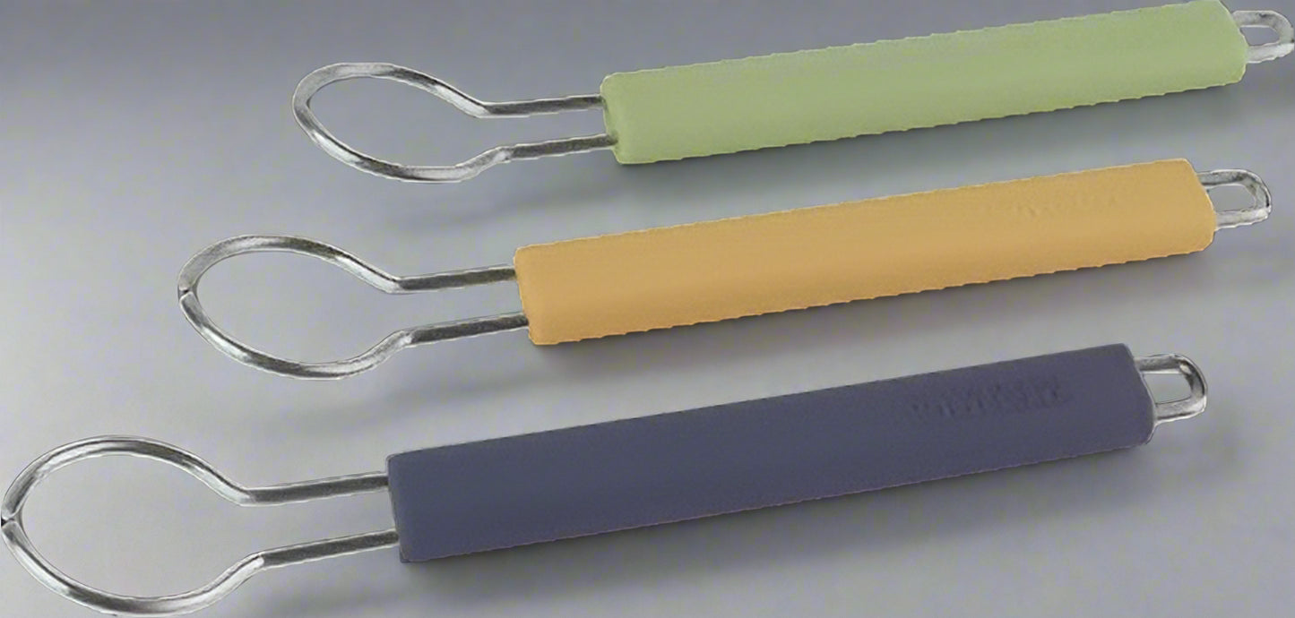 Three Redecker silicon holders for dish brush heads with colourful handles on a white background
