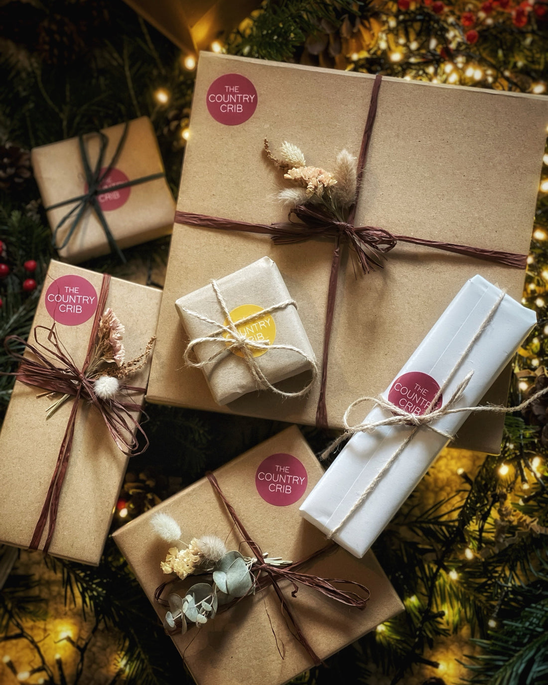 A selection of eco-conscious festive boxed gift sets brought to you by The Country Crib, beautifully and sustainably wrapped in Kraft gift boxes, raffia and dried flowers