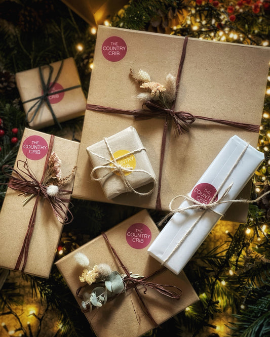 A selection of eco-conscious festive boxed gift sets brought to you by The Country Crib, beautifully and sustainably wrapped in Kraft gift boxes, raffia and dried flowers