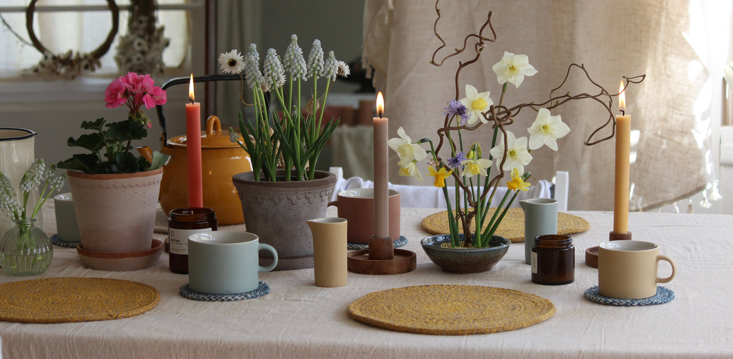 Spring Edit at The Country Crib - It's singing spring at The Crib, with powdery cornflower blues and mustards. Potted plants using our wonderful range of RAW terracotta Bergs Pottery, plant-based dinner candles, Japanese bowls and minimal cups and jugs.