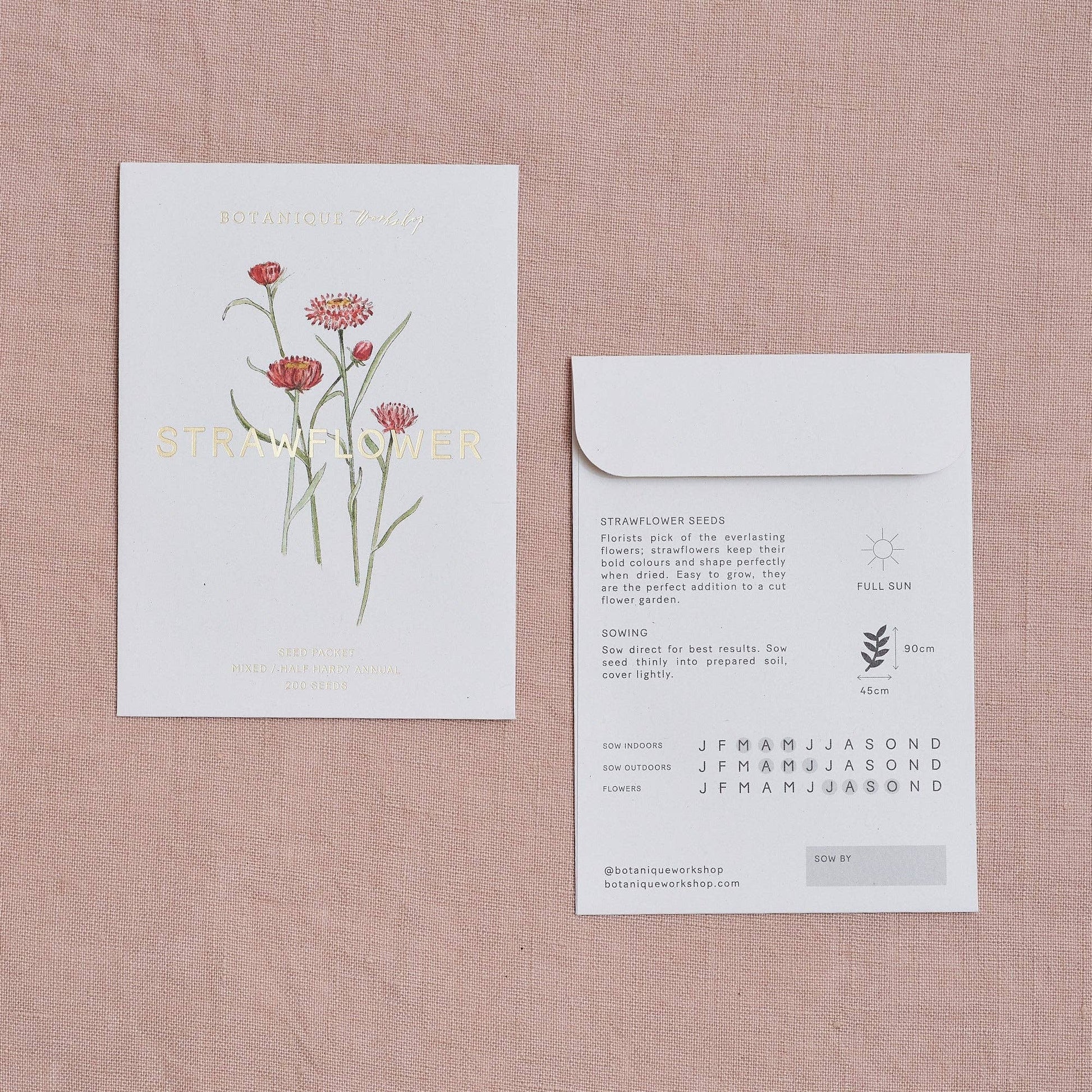 Seed packet with floral design on a pink textured background