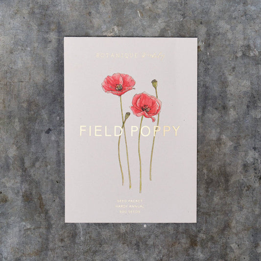 Seed packet with red poppies and 'Field Poppy' text on a textured gray background