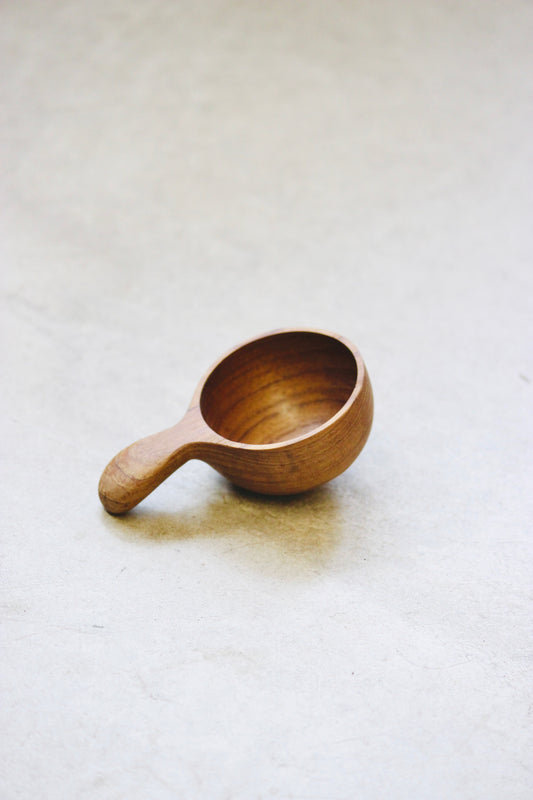The Amuze Spoon is a versatile tool that can be used to serve appetizers or scoop up coffee and tea. Made from durable and reclaimed teak root wood, each piece boasts a unique, organic design and is food safe.