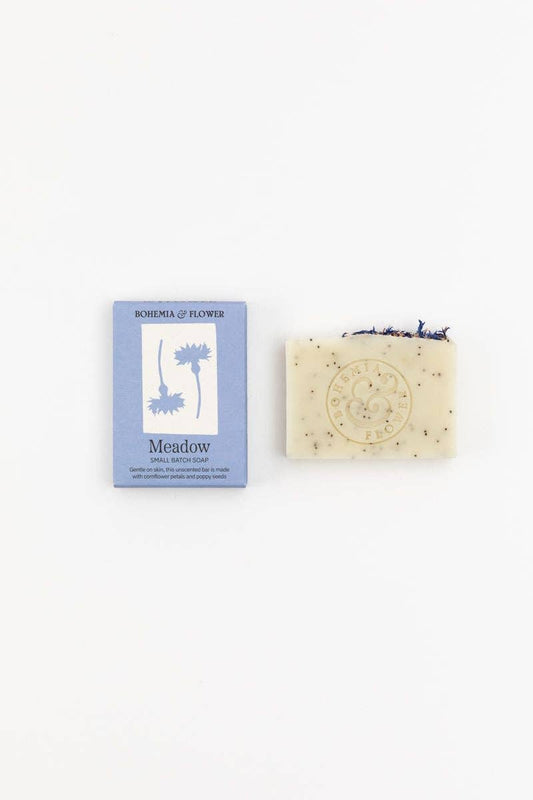 Bar of soap with packaging labeled 'Meadow' on a white background