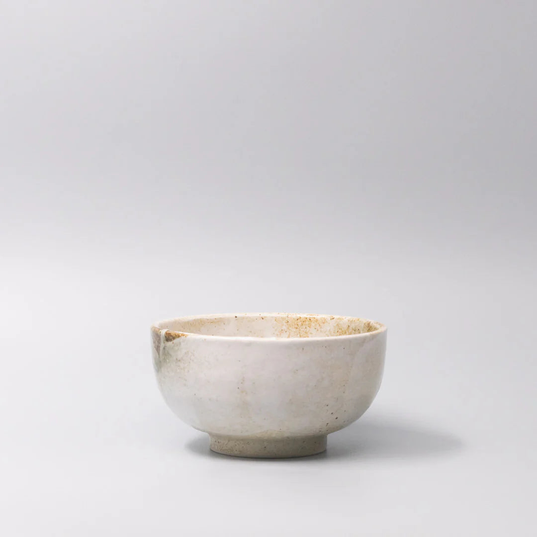 White ceramic bowl on a light gray background