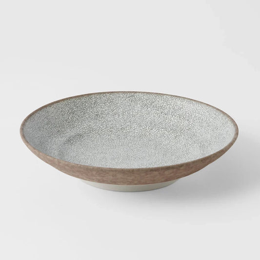 Ceramic bowl with textured surface on a white background. Crazed Grey Shallow Bowl made in Japan 