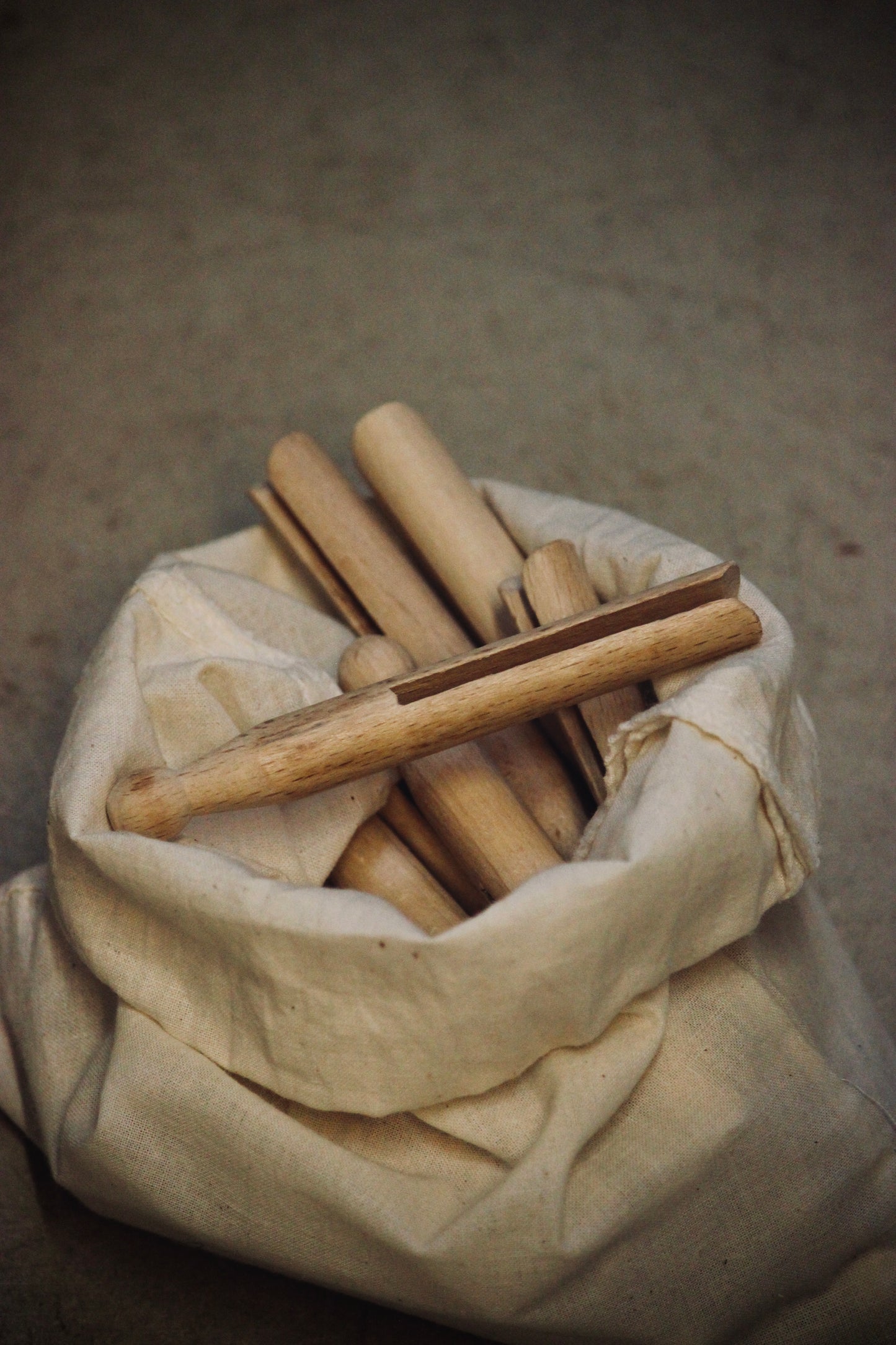 Traditional style wooden pegs. Available as a set of 25 in a cloth drawer-string bag, or singularly
