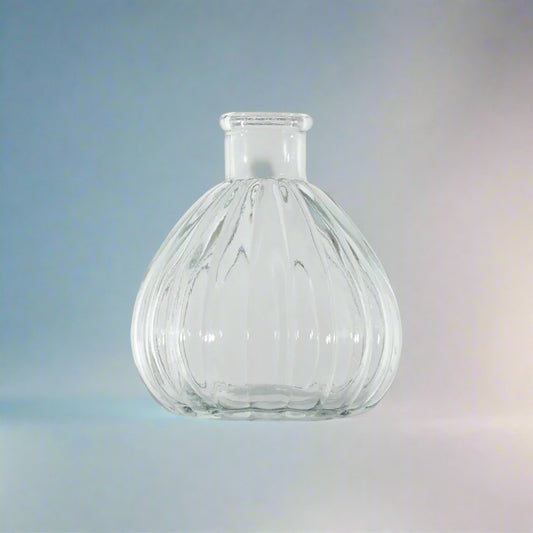 A beautiful clear glass Fleur Ribbed Bud Vase with elegant ribbed detailing.&nbsp;

Perfect for single blooms, as a candle holder, or for wedding centrepieces. This versatile piece adds sophistication to any space while beautifully displaying small floral arrangements.