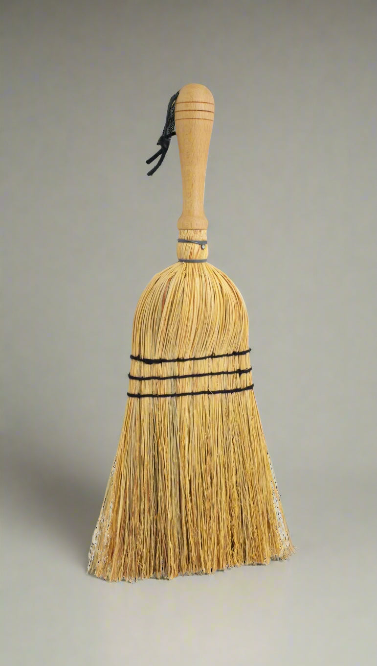 Crafted from oiled beechwood and rice straw, this hand brush is ideal for indoor and outdoor use. Its non-absorbent properties make it perfect for sweeping up car mats and other surfaces. Measuring at 43cm, this is a smaller handheld brush designed in the shape of a broom. Please note that it is not a full-size broom.