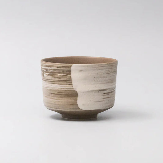 Ceramic cup with a unique design on a white background