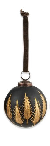 Four black and gold ornament balls with ribbed texture on a white background