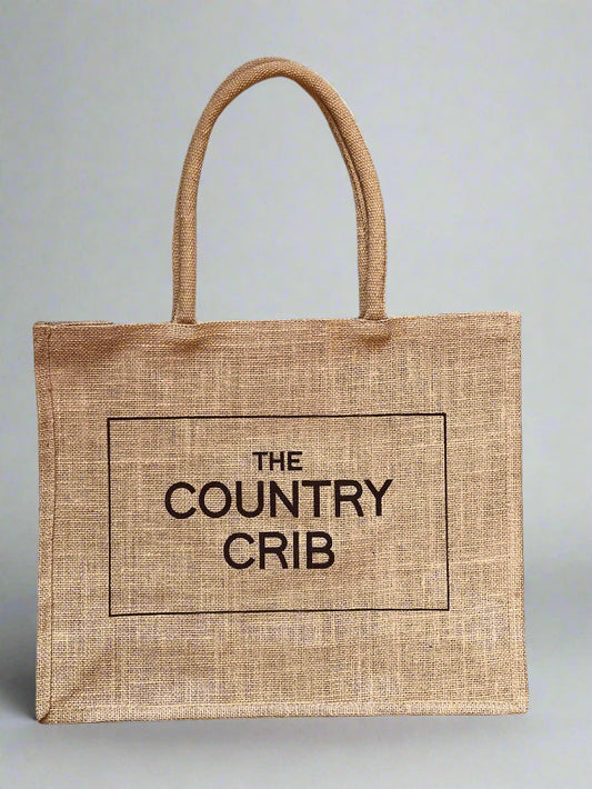 Jute bag with 'The Country Crib' text on a gray background