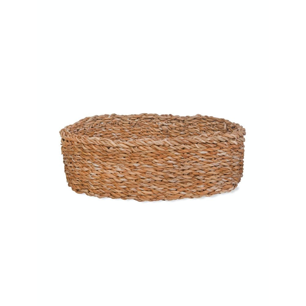 Woven basket made of natural materials on a white background