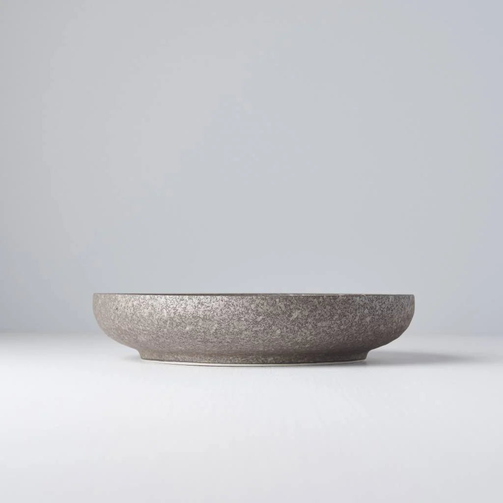 Gray ceramic bowl on a light gray background