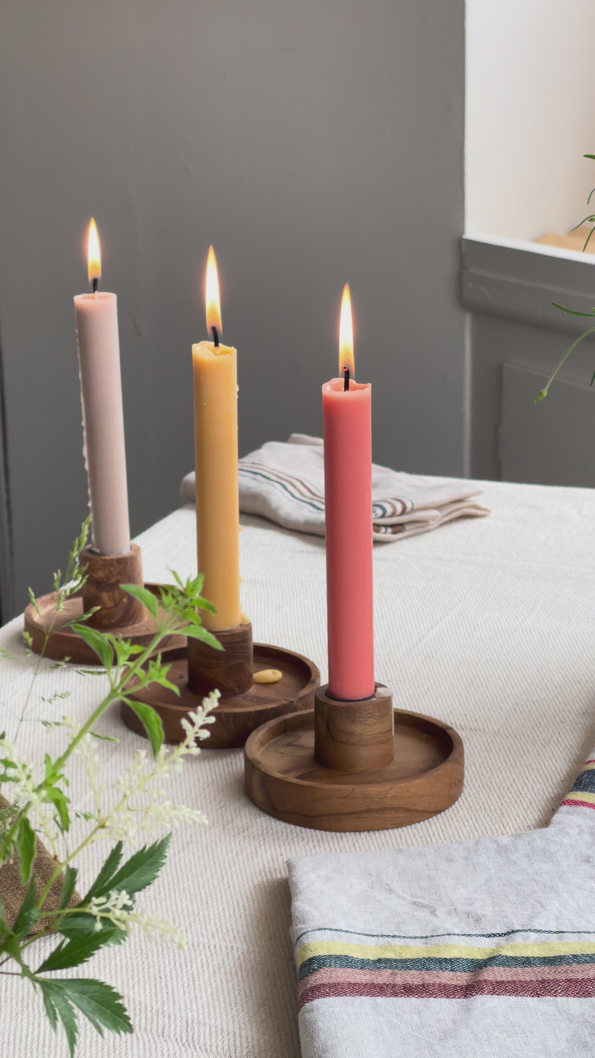 luna candle holder with three lit candles