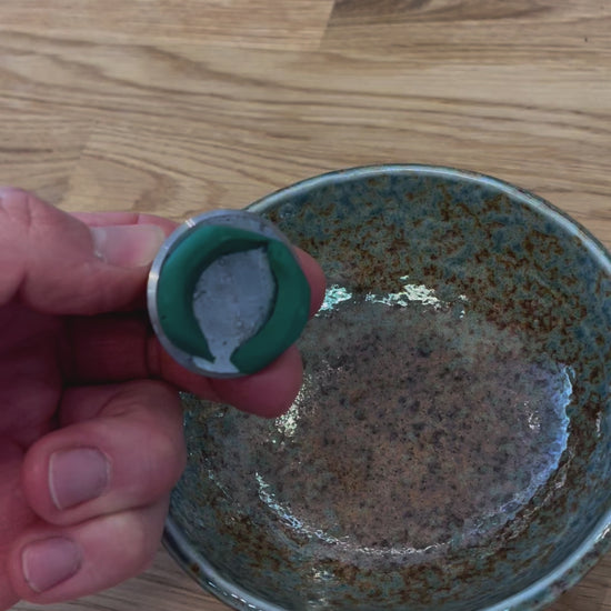 Video of floral sticky clay applied to the base of a Flower Frog Pin Holder, into a flower bowl