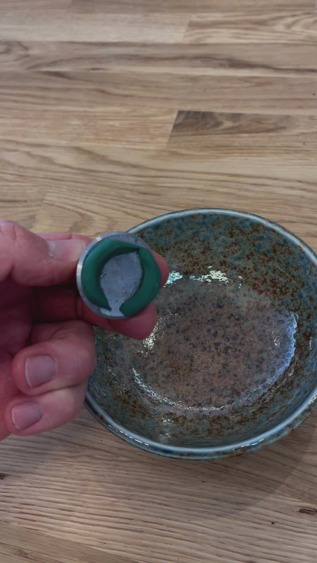 Video of floral sticky clay applied to the base of a Flower Frog Pin Holder, into a flower bowl